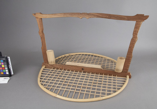 Hearst Museum object 2 of 2 titled Bird roost, accession number 18-514, described as Bird roost; round base of bamboo hoop and sticks; mahogany handle; two bamboo cups. For “Balam,” a dove like bird kept as a pet; made by specialist. Height 33.4 cm.