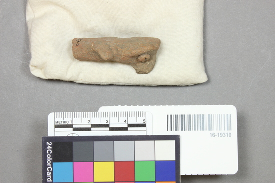 Hearst Museum object 10 of 12 titled Figurine, accession number 16-19310, described as Figurine fragment, pottery, human figure, base missing, arms broken, circular head, curved nose, coffee bean eyes, height, 5.05 cm