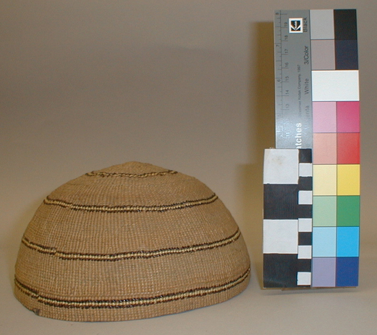 Hearst Museum object titled Hat, accession number 1-9518, described as Woman's basketry hat with horizontal stripes. Domed top. Plain twined. 3 strand twining at start. 2 single rows define design zones. Single faced overlay. Xeropyllum tenax and maidenhair fern.