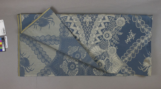 Hearst Museum object titled Textile, accession number 2-62494, described as Strip; silk?, damask, blue ground, gray designs, floral motives, Jacquard looms