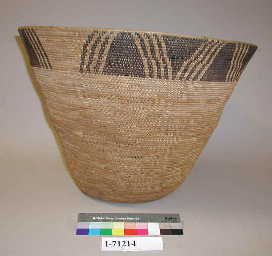 Hearst Museum object titled Basket, accession number 1-71214, described as Coiled, with wide mouth and sloping sides. Decoration: cladium root and bracken fern root. Decorative band of solid black triangles and lines. 3-rod coiling with interlocking stitches and herringbone rim.