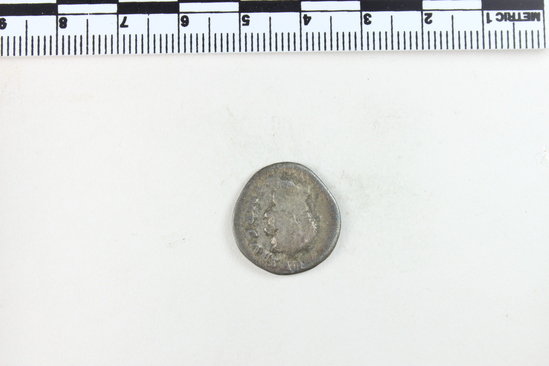 Hearst Museum object 5 of 8 titled Coin: ar denarius, accession number 8-4690, described as Coin; AR; Denarius; Roman. Vespasian, 74 AD. Rome, Italy. Obverse: IMP CAESAR ___ ___, bust r. laureate. Reverse: COS V; to left and right, two laurel branches. CF American Numismatic Society coin 1985.140.42 with inscription Obverse: IMP CAESAR VESP AVG. Reverse: COS V.