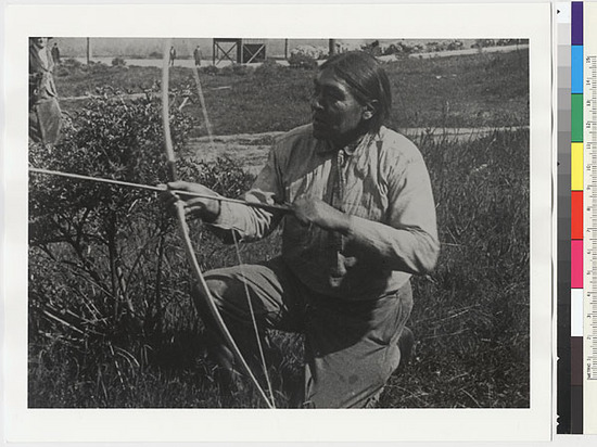 Hearst Museum object titled Black-and-white negative, accession number 15-6005, described as Ishi using bow to illustrate release