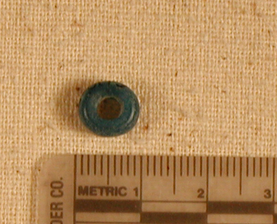 Hearst Museum object titled Bead, accession number 6-8119, described as Bead:  blue glaze disc.