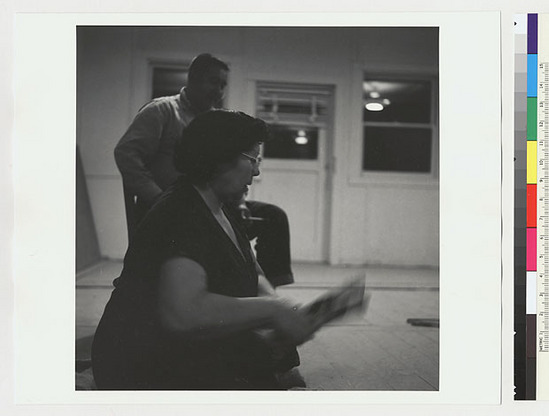 Hearst Museum object titled Black-and-white negative, accession number 15-19547, described as Essie Parrish playing stick game, Sidney Parrish watching