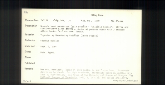 Documentation associated with Hearst Museum object titled Head decoration, accession number 7-5139, described as Women's head decoration (jgla galička - "Galičnik needle"); silver and coral-colored glass beads; 4 chains of pendant discs with 3 stamped silver hooks; 34.5 cm max. length