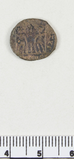 Hearst Museum object 2 of 6 titled Coin: æ 4, accession number 8-8711, described as Coin, AES Follis 4. 1.42 grams. 14 mm. Obverse: Constantius II right, diademed CONSTANTINVS AVG Reverse: Standard between 2 soldiers, Gloria Exercitvs Mint Data: Constantius II