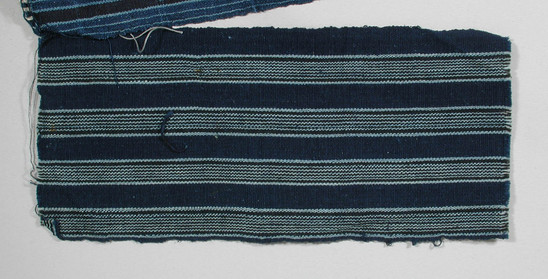 Hearst Museum object titled Textile fragment, accession number 5-11077, described as Textile sample (section of narrow band weaving): Dark royal blue stripes alternating with four stripes of pale blue divided by black lines.