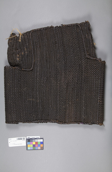 Hearst Museum object titled Armor vest, accession number 11-41138, described as “Armor” vest; rattan; coiled from edge to edge with heavy braided string arm’s eye. Length 41.5 cm, width 41.5 cm. Defensive clothing for warfare.