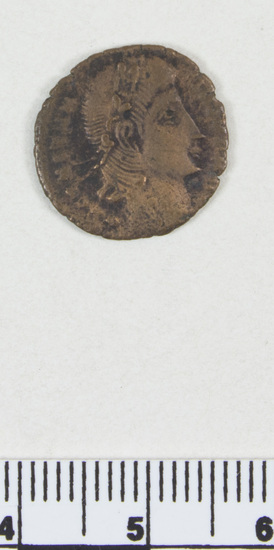 Hearst Museum object titled Coin: æ, accession number 8-8588, described as Coin; bronze; obverse: head of Constantine I; reverse: standards between soldiers