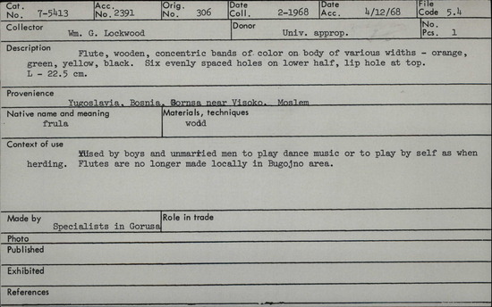 Documentation associated with Hearst Museum object titled Wool & spinning piece, accession number 7-5413, described as Flute, wooden, concentric bands of color on body of various widths- orange, green, yellow, black. Six evenly spaced holes on lower half, lip hole at top. length: 22.5cm Used by boys and unmarried men to play dance music or to play by self as when herding. Flutes are no longer made locally in Bugojno area. Made by specialists in Gorusa