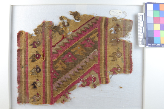 Hearst Museum object 2 of 5 titled Tapestry fragment, accession number 16-980, described as Fragment of heavy finely woven tapestry decorated with bird and step design