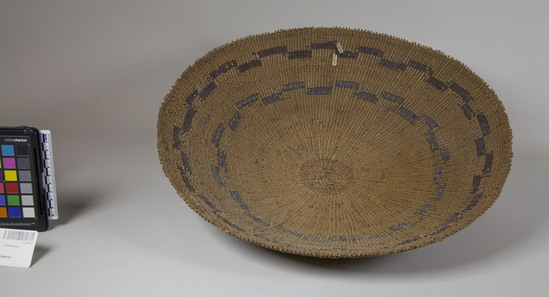 Hearst Museum object 3 of 4 titled Basket, accession number 1-28432, described as Twined basket tray.  3 brown bands in design.