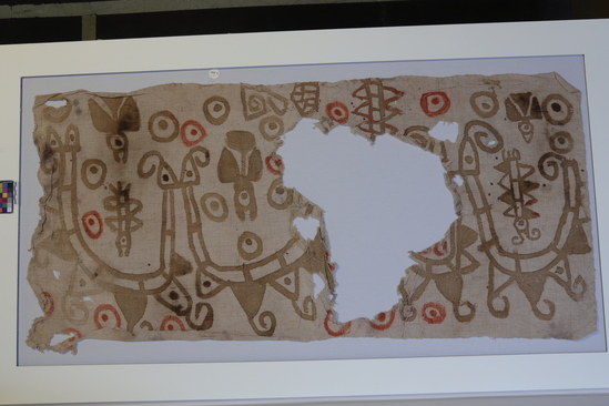 Hearst Museum object 1 of 7 titled Painted cloth fragment, accession number 4-7220, described as Fragmentary rectangular piece of coarse painted cloth, design in olive brown and brick-red, 48x23”