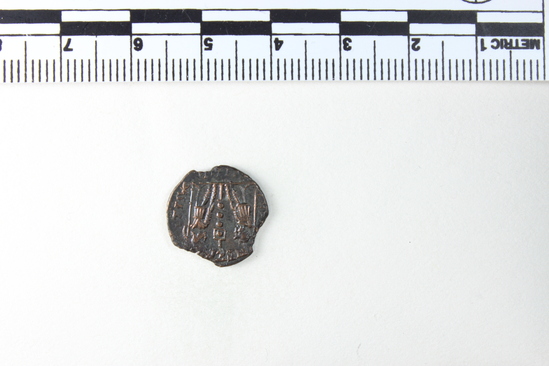 Hearst Museum object 5 of 8 titled Coin: æ 4, accession number 8-7324, described as Coin, AES Follis 4.      1.05 grams. 14mm. Obverse: Constantinus II Reverse: 1 Standard between 2 soldiers