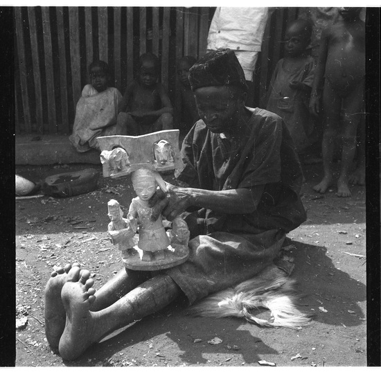 Hearst Museum object titled Black-and-white negative, accession number 15-30896, described as Black and white negative, 2.25'' Nigeria, Meko, Duga's beginning paint on Oshe Shango, Plate VI, 1951