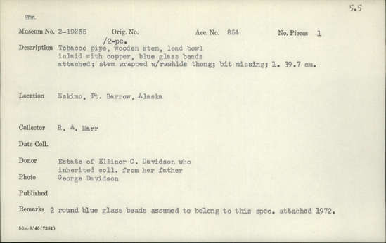Documentation associated with Hearst Museum object titled Tobacco pipe, accession number 2-19235, described as Tobacco pipe with 2-piece wooden stem, lead bowl inlaid with copper, blue glass beads attached.  Stem wrapped with rawhide thong, bit missing.