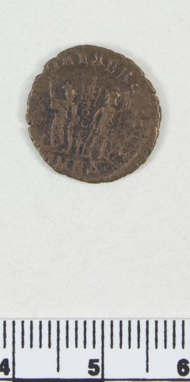 Hearst Museum object 4 of 4 titled Coin: æ, accession number 8-8588, described as Coin; bronze; obverse: head of Constantine I; reverse: standards between soldiers