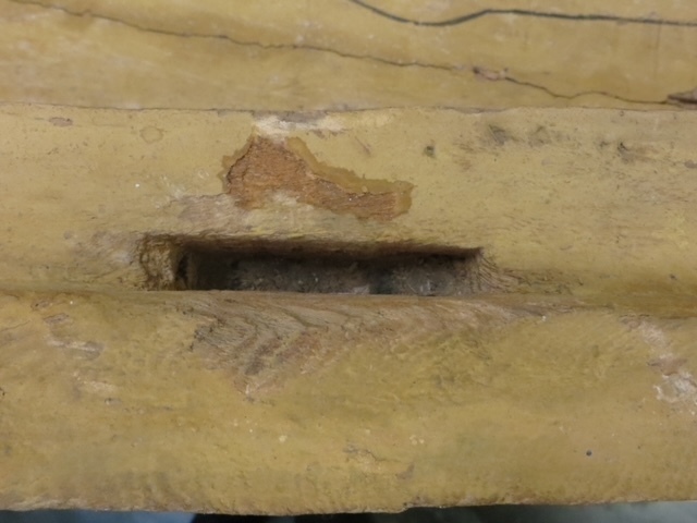 Hearst Museum object 111 of 167 titled Coffin, accession number 6-19912, described as Wooden anthropoid coffin. Inscription running down center of lid. Determined by Kea Johnston to probably be the outer coffin of Iwefaa (6-19928, 12-11039). According to Kea Johnston, "This coffin belonged to a man named Iwefaa, whose name is inserted in the middle of the spells written in the two columns on the front. This coffin is likely the outer coffin for PAHMA 6-19928 based on the similarity of the owner's name, unusual costume, and the paleography of the inscription. Both coffins were purchased on the antiquities market by George Reisner for Phoebe A Hearst. However, stylistically, they are very similar to a set of coffins known to have come from the site of Akhmim, which was excavated in the 1880s by Gaston Maspero, and which has heavily looted for the antiquities market during this decade." "The pectoral vignette between the text and the collar shows the deceased standing before squatting baboon and is the source of our logo. The hieroglyph for 'sky' is above their heads, and the side borders are formed by a pyramid and the symbol for the West.