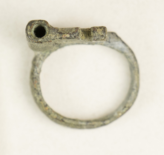 Hearst Museum object titled Key, accession number 8-66, described as Bronze ring key 2 cm.
