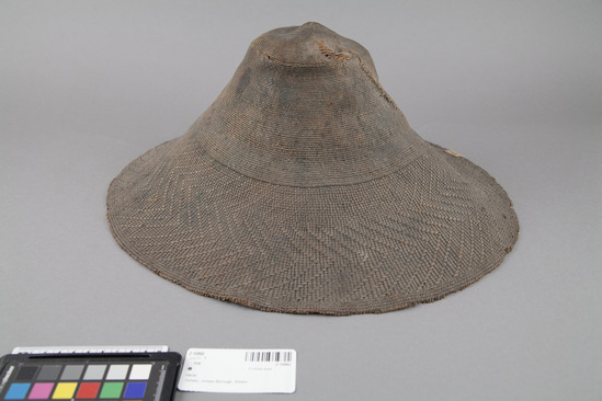 Hearst Museum object 2 of 2 titled Hat, accession number 2-10860, described as Soft twined basketry dance hat; no inside band.  Made from spruce root. Worn, native mending.