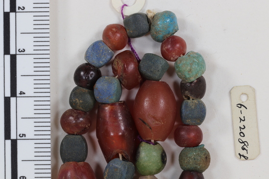 Hearst Museum object 5 of 5 titled Beads, accession number 6-22085, described as beads: a) blue frit cubes, carnelian, one amethyst b) small blue frit, etc. c) blue-green faience