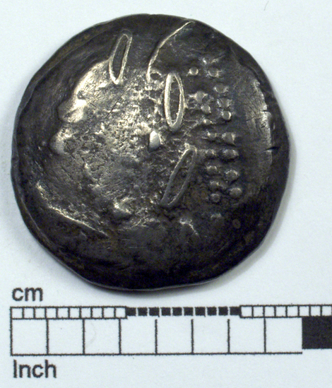 Hearst Museum object titled Coin: ar tetradrachm (barbarous imitation), accession number 8-4488, described as Coin; AR; Tetradrachm; Greek. 13.63 grams, 25 mm. Obverse: traces of head l. laureate. Reverse: Horseman r. Remarks: "Barbarous imitation of Philip II