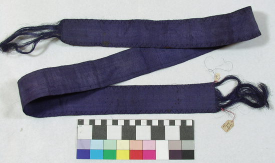 Hearst Museum object titled Belt, accession number 11-207, described as Belt or ribbon of fiber, violet.