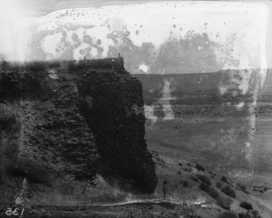 Hearst Museum object titled Black-and-white negative, accession number 15-135, described as Detailed view of the corner embankment of the Campo Santo showing details of wall construction; note male Indian in bottom photograph