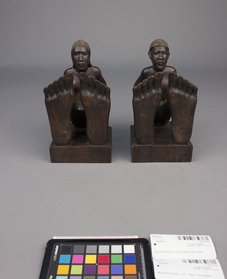 Hearst Museum object 2 of 8 titled Wood figurine, accession number 10-3141a,b, described as Bookends, wooden, male and female figures, 27 centimeters by 10 centimeters