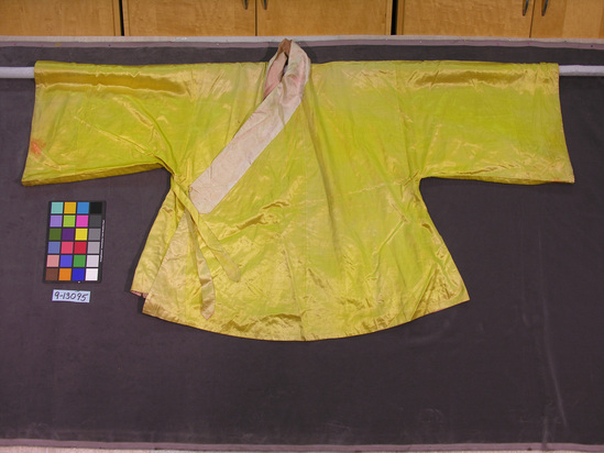 Hearst Museum object titled Robe, accession number 9-13095, described as Robe; silk; plainweave; white stion band sewn around neck opening; pink cotton lining; fastened with tie under right sleeve; 91-99 centimeters long; 89 centimeters wide beneath sleeves; 46-51 centimeter wide at sleeve