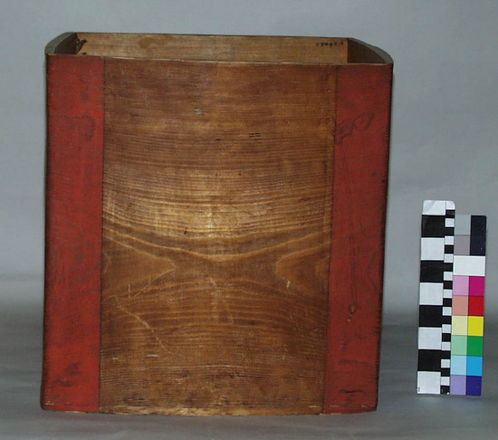 Hearst Museum object titled Box, accession number 2-28880, described as Square, cedar, red stripes at corners, rawhide lashings on one side. Bentwood cube; cover missing.