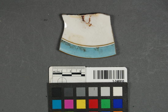 Hearst Museum object titled Plate fragment, accession number 1-246910, described as Ceramic plate rim foot refined white earthenware; hand-painted