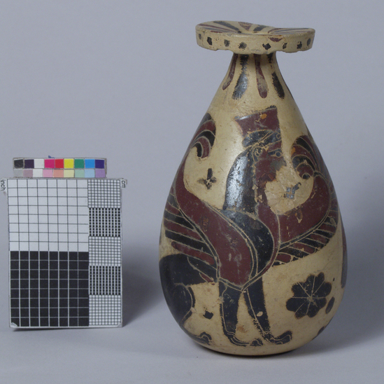 Hearst Museum object 1 of 6 titled Aryballos, accession number 8-7752, described as Aryballos; piriform; purple and black sphinx; purple and black goose; black rosette filling ornament; incised detail, single handle.