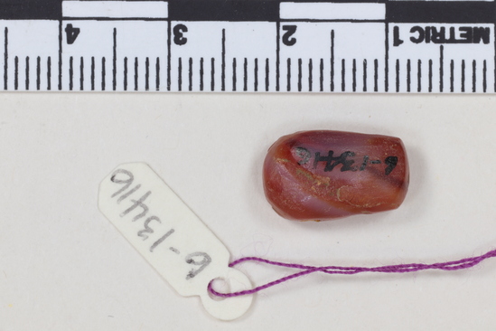 Hearst Museum object 2 of 2 titled Bes pendant, accession number 6-13416, described as Carnelian Bes pendant.