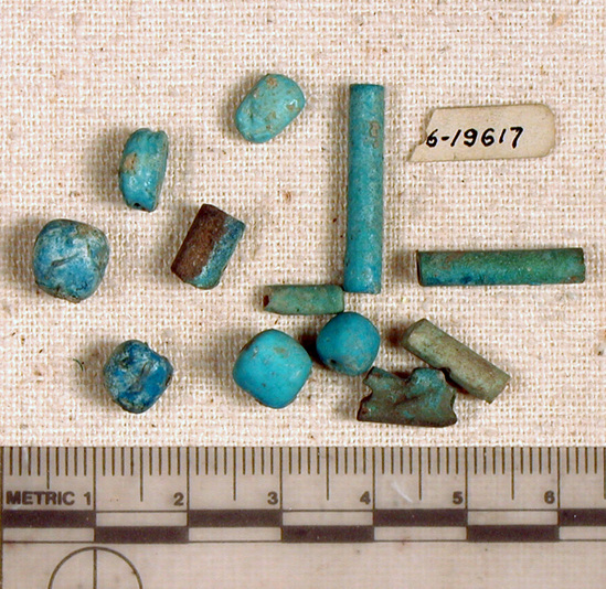 Hearst Museum object titled Beads, accession number 6-19617, described as beads: five blue tubular, four blue glaze spherical, one blue glaze carved, two blue glaze scarabs