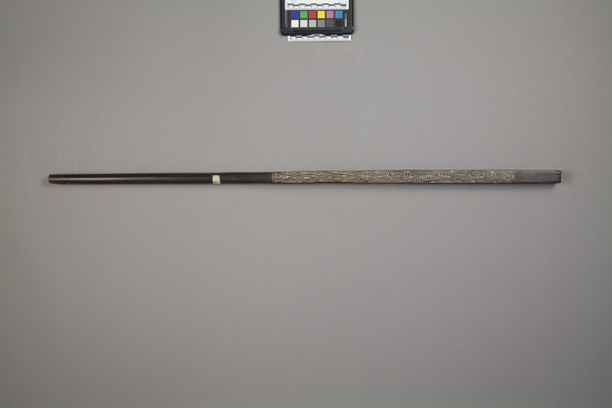 Hearst Museum object titled Walking stick, accession number 11-42731, described as Club, wood, squared sides, incised design on all four sides. 86.2 cm.