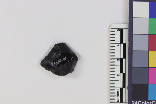 Hearst Museum object titled Flake, accession number 16-14412, described as Projectile point fragment; obsidian; triangular; weight: 2.41 grams; length: 2.11 cm; width: 2.25 cm; depth: 0.75 cm.