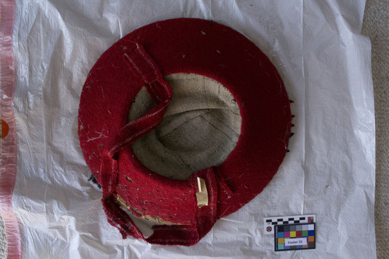 Hearst Museum object titled Hat, accession number 3-32052, described as Woven hat, red textile with pattern, worn with skirt 3-32053