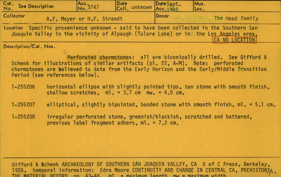 Documentation associated with Hearst Museum object titled Charmstone, accession number 1-255208, described as Perforated Charmstone; irregular perforated stone, greenish/blackish, scratched and battered, previous label fragment adhers