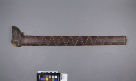 Hearst Museum object titled Scabbard, accession number 10-420, described as Kris scabbard of red wood; upper end broken; 2 piece; wrapped with cord