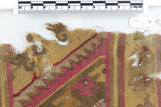 Hearst Museum object 5 of 5 titled Tapestry fragment, accession number 16-980, described as Fragment of heavy finely woven tapestry decorated with bird and step design