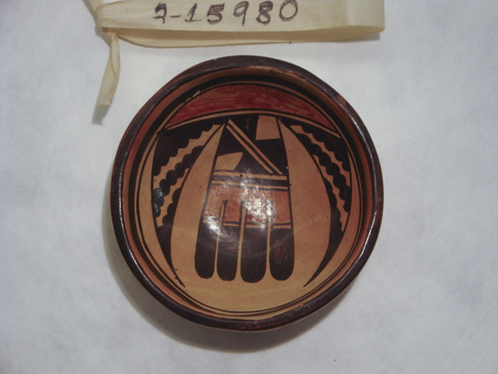 Hearst Museum object titled Bowl, accession number 2-15980, described as Ceramic, flattend base, stylized feather design on interior in black and red buff ground, brown rim and framing lines. Molded, painted, varnished.