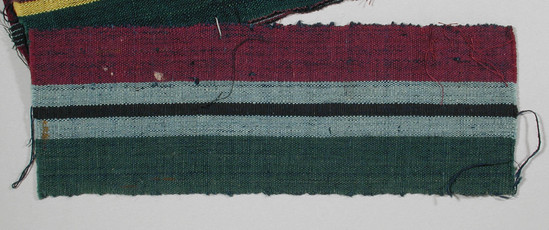 Hearst Museum object titled Textile fragment, accession number 5-11251, described as textile sample (section of narrow band weaving): one stripe of deep rose, one stripe pale blue with black stripe running down middle, one stripe of green.