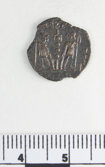 Hearst Museum object 3 of 8 titled Coin: æ 4, accession number 8-7324, described as Coin, AES Follis 4.      1.05 grams. 14mm. Obverse: Constantinus II Reverse: 1 Standard between 2 soldiers