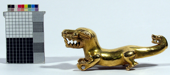 Hearst Museum object 1 of 6 titled Dog figurine, accession number 3-3420, described as Gold figurine of a dog.