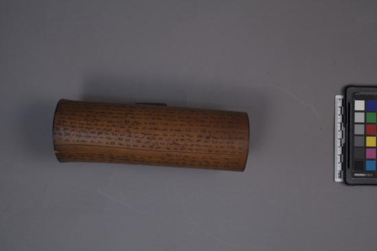 Hearst Museum object titled Tube, accession number 18-1718, described as wooden tube with carved script; scroll?