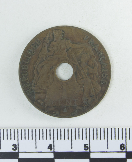 Hearst Museum object titled Coin: copper 1 cent, accession number 9-6072, described as Coin; Cu; one cent. Obverse: 2 seated women. Reverse: oriental script with center hole; 1913