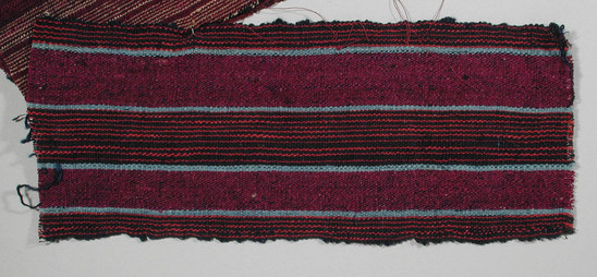 Hearst Museum object titled Textile fragment, accession number 5-11291, described as textile sample (section of narrow band weaving): central and side stripes blakc with red lines, four narrow stripes light blue, two wide stripes of magenta.