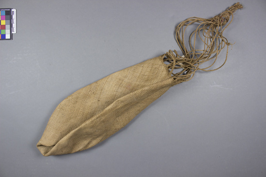 Hearst Museum object titled Fiber bag, accession number 11-42787, described as Bag, fiber, plaited, 22 cord handle, knotted at top, brown. 33.0 cm.